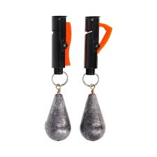 Two silver sinkers with black holders on a white background