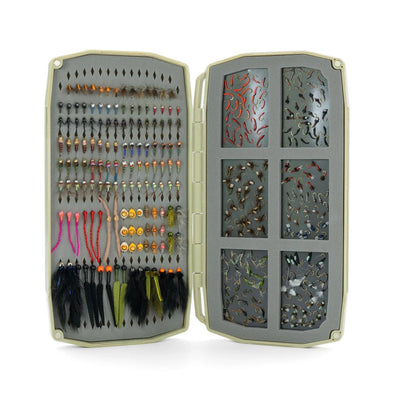 Umpqua UPG Foam Tailwater Large Fly Box open with a variety of trout flies arranged in foam and magnetic compartments.